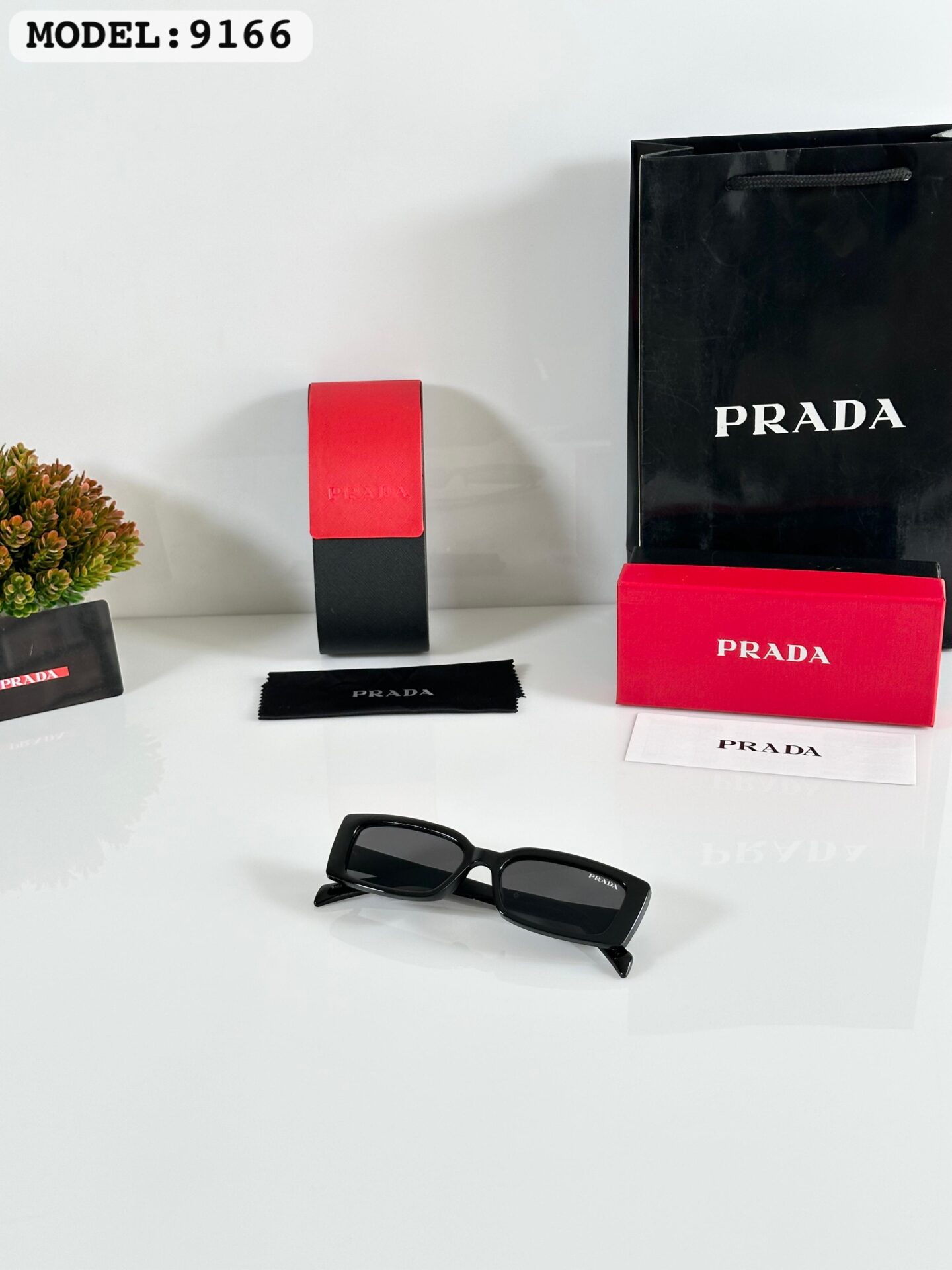 Buy First Copy Prada rectangular Unisex Sunglasses – premium 1:1 master replica with original box packaging. Cash on Delivery available, Free shipping across India, Pan India delivery, UV400 protection lenses